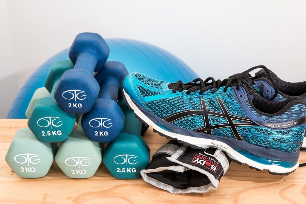 exercise shoes and dumbells